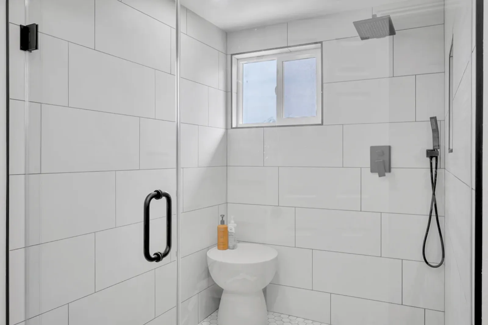 Finished bathroom with a walk-in shower from a PMK Development project in Fullerton