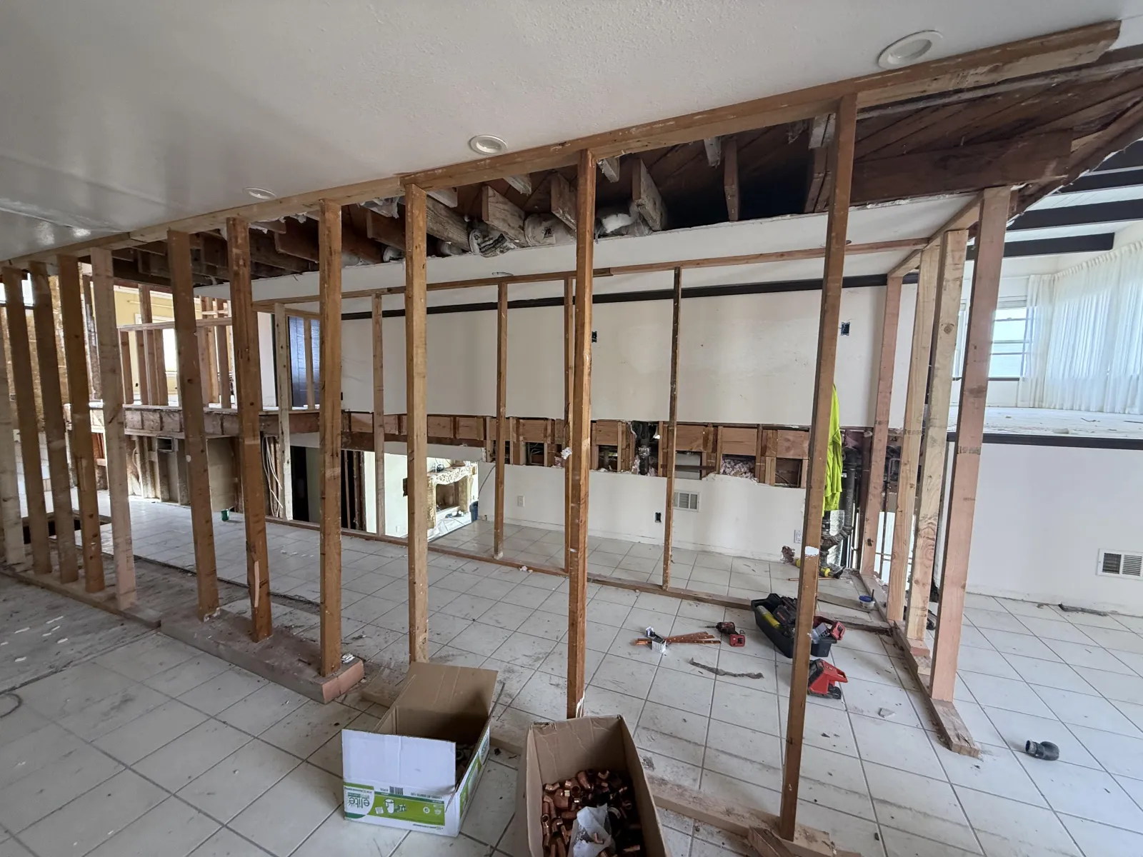 Wood stud framing for a new interior layout at the Cartier full home remodel in Rancho Palos Verdes.