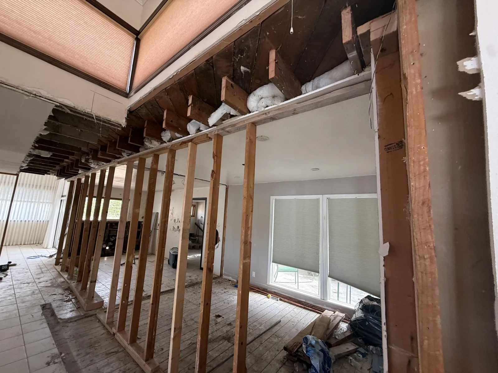 Exposed framing and skylight beside the hallway at the Cartier full home remodel in Rancho Palos Verdes.