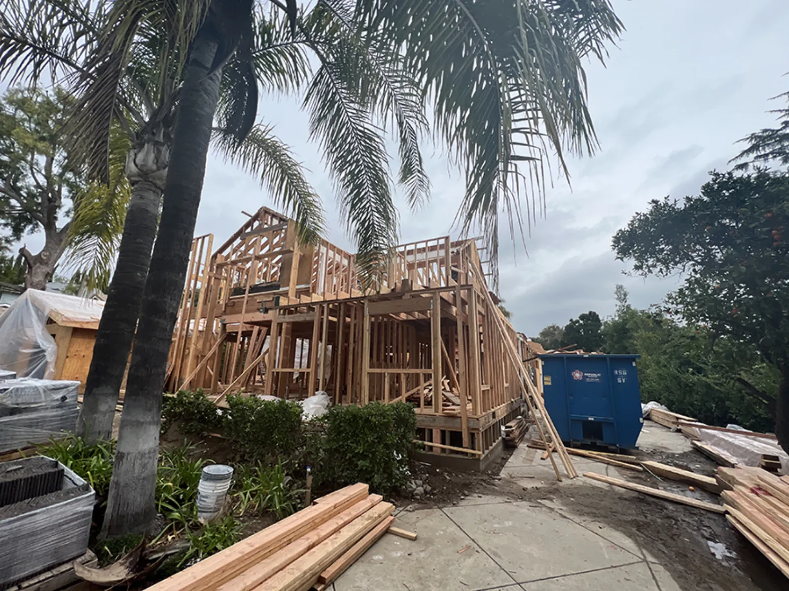Chevy Chase ground-up build, two-story framing rising on site, La Cañada Flintridge