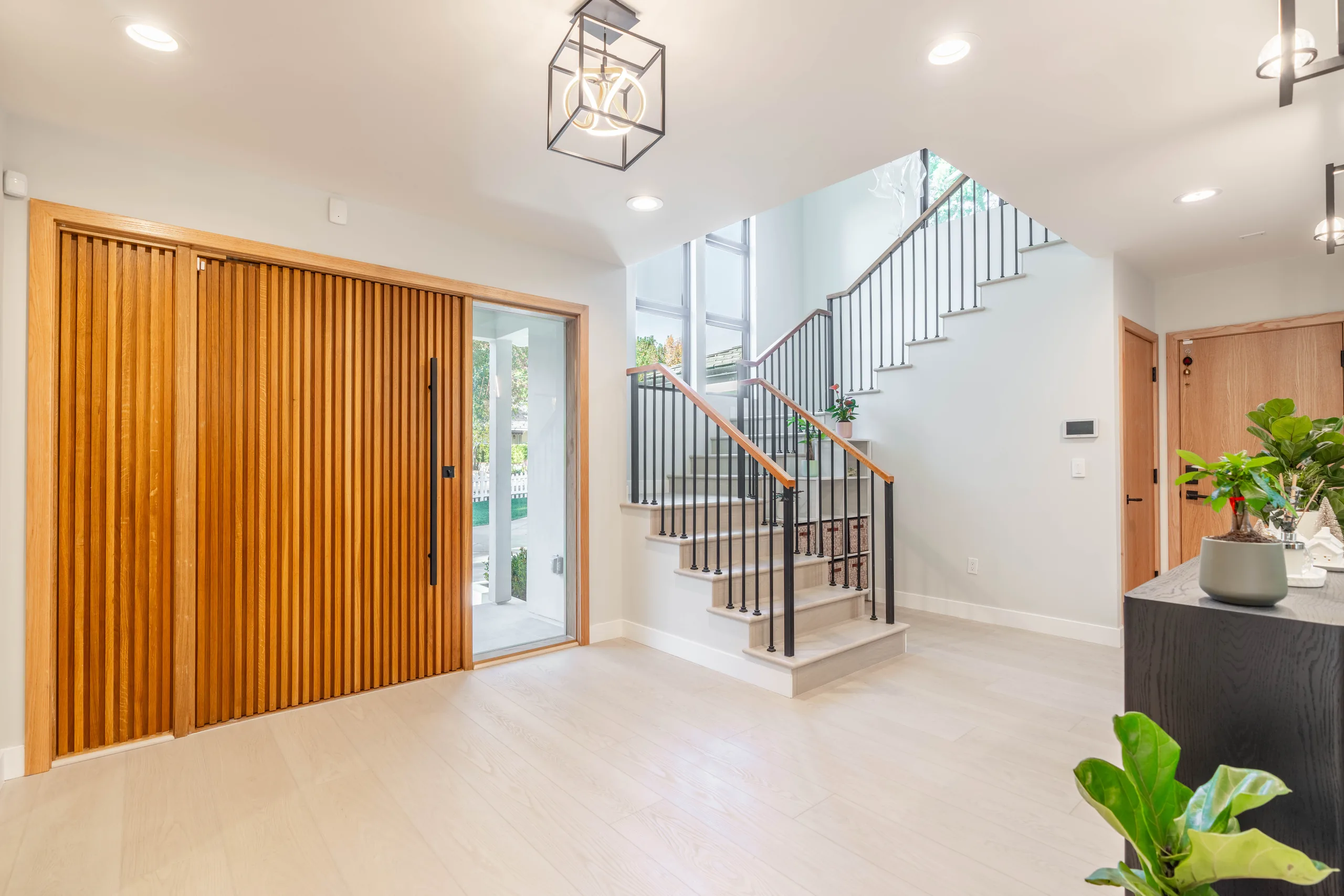 Finished entry and stair hall from a PMK Development new-construction project in La Cañada Flintridge