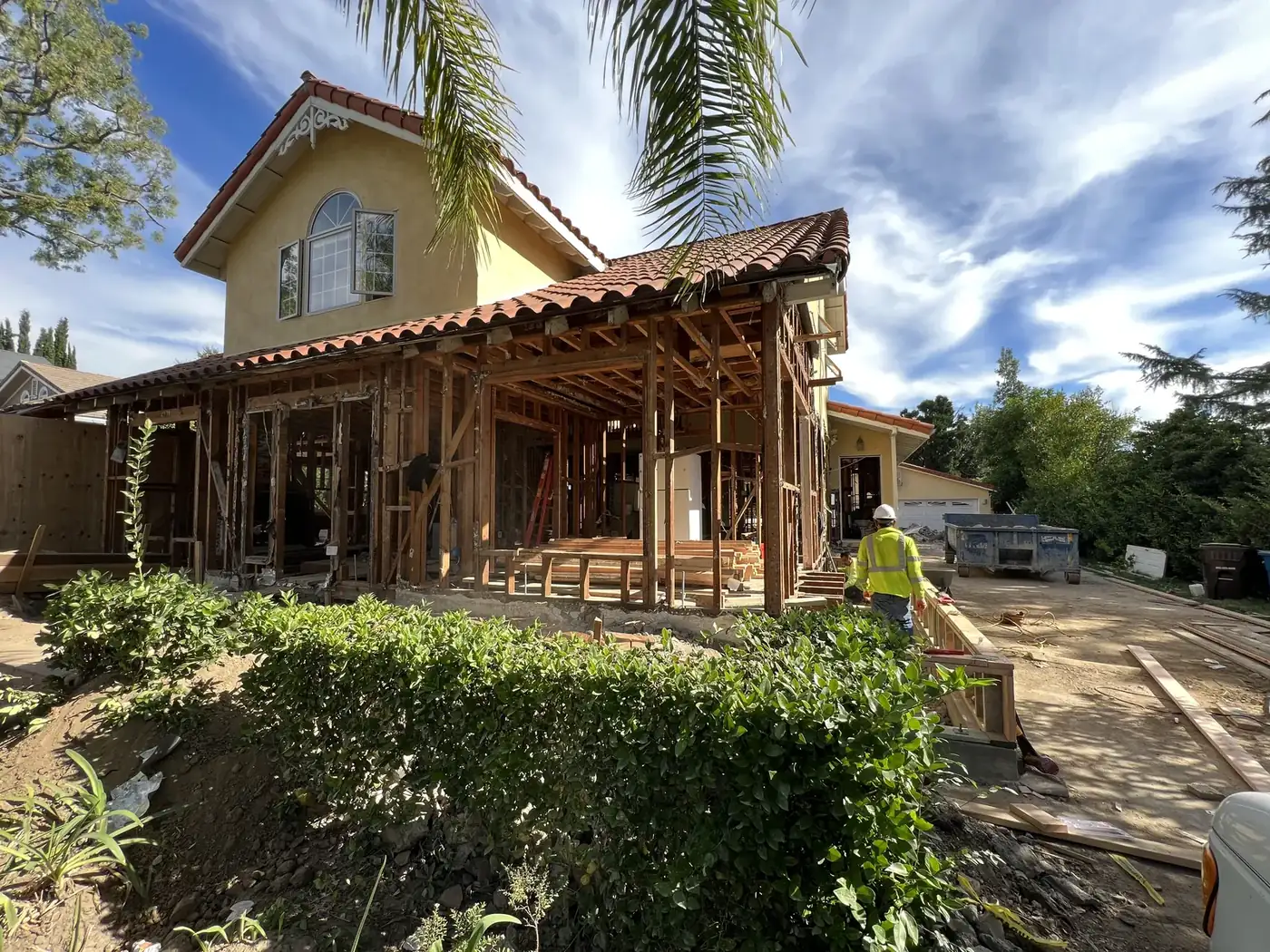 First-floor walls stripped to exposed studs during demolition at PMK Development's ground-up construction project in La Cañada Flintridge.