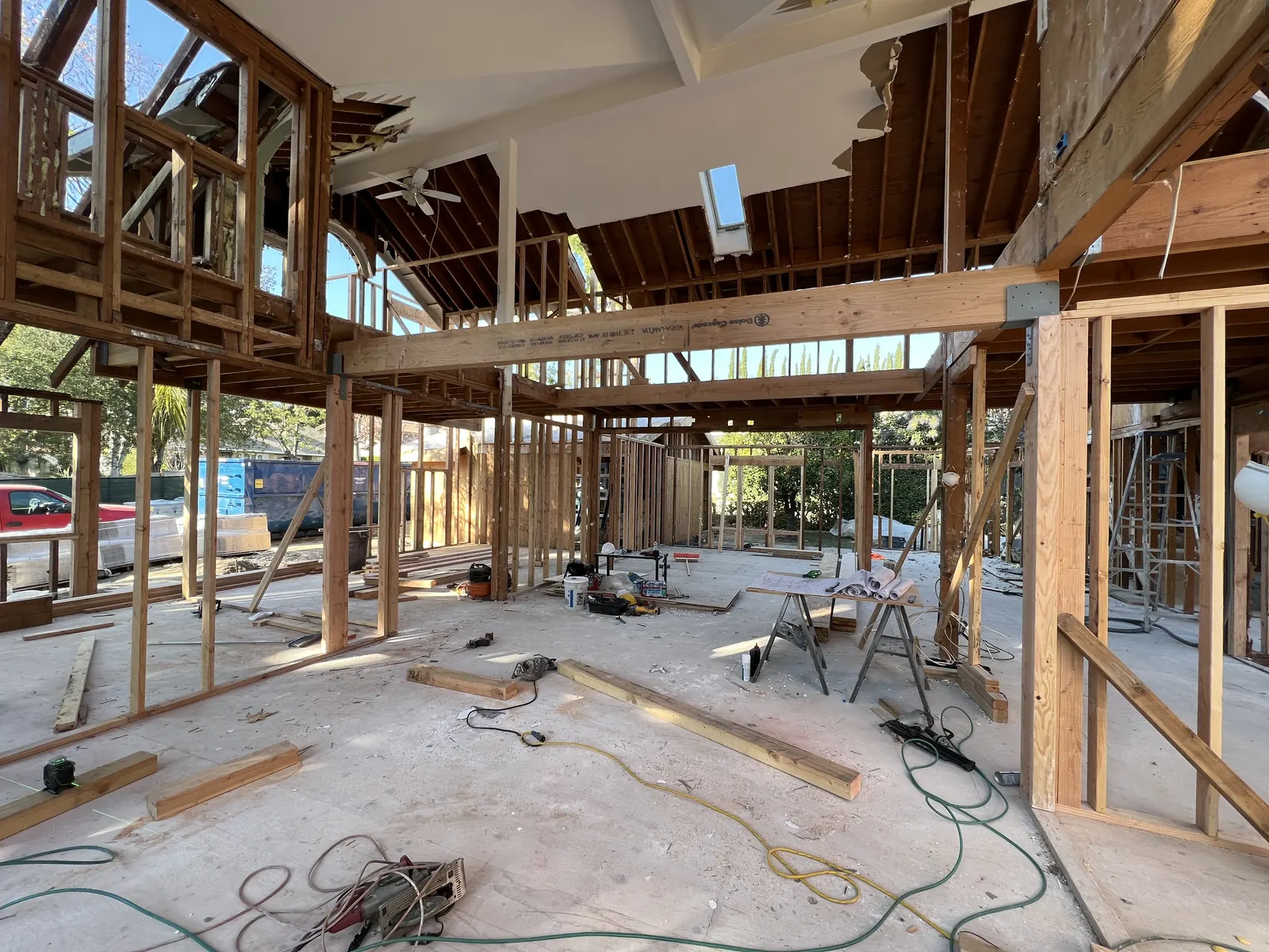 Engineered structural beams spanning the open interior framing at PMK's new-construction home in La Cañada Flintridge.