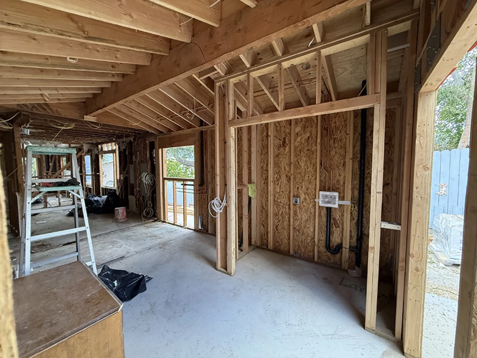 Room addition framing in progress at a PMK Development project in La Crescenta
