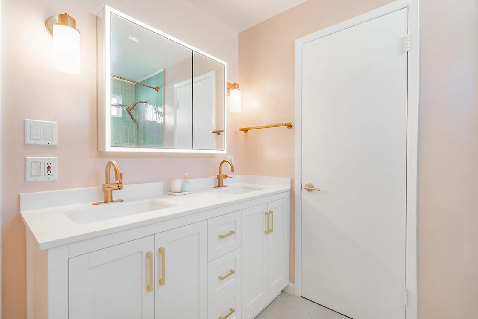 Custom home renovation, vanity mirror and brass sconces, Burbank, CA