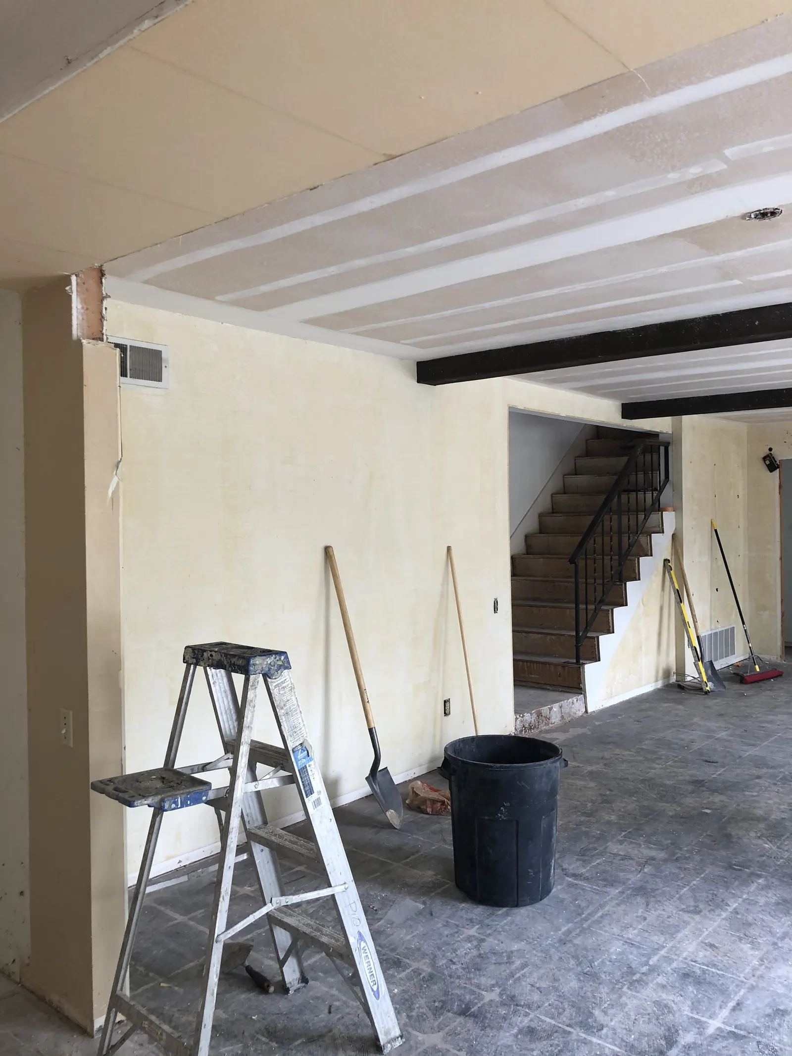 Exposed kitchen ceiling joists with new electrical runs pulled through during the PMK home remodel on Glenwood Avenue in Fullerton.