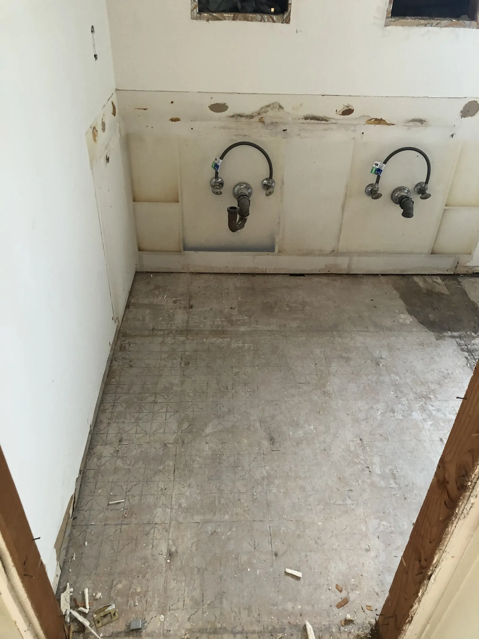 Hallway bathroom with new drywall hung and vanity light and supply stub-outs in place during the PMK home remodel on Glenwood Avenue in Fullerton.