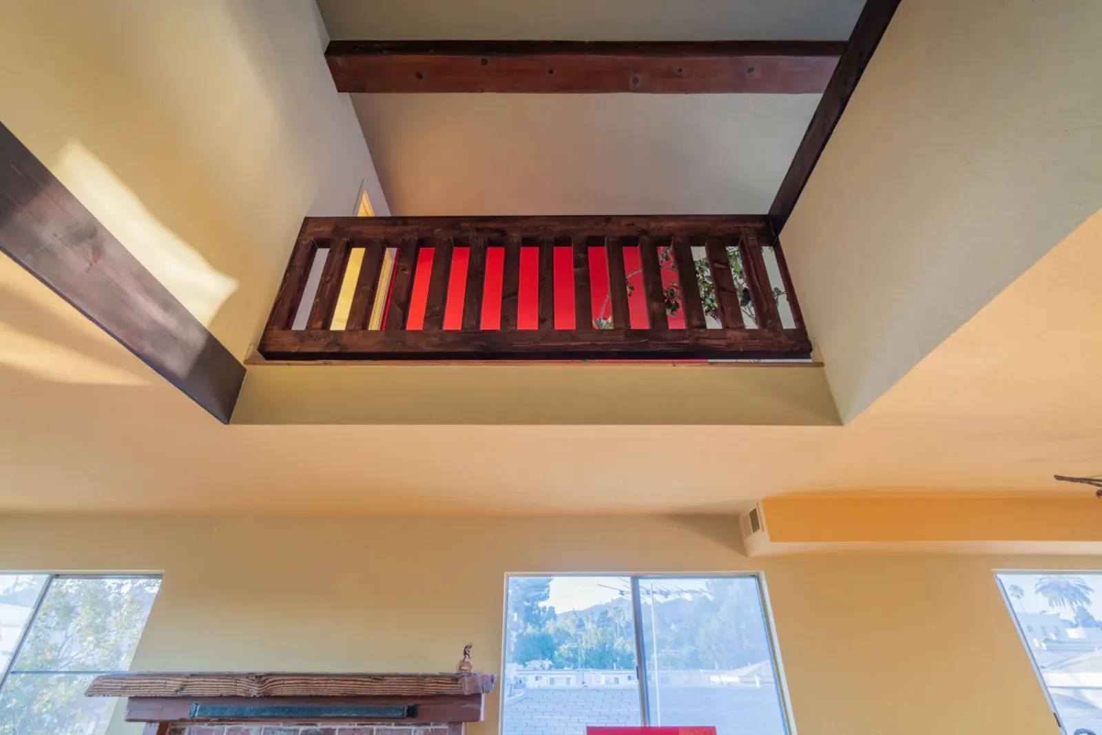 Harvard Ave remodel, loft railing viewed from the room below, Los Angeles