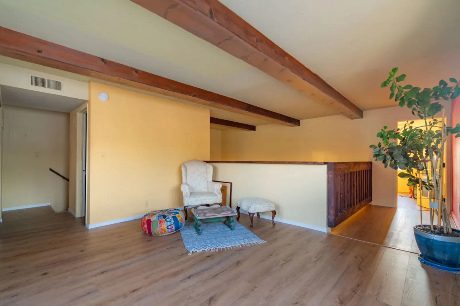Harvard Ave remodel, loft landing with wood flooring and railing, Los Angeles