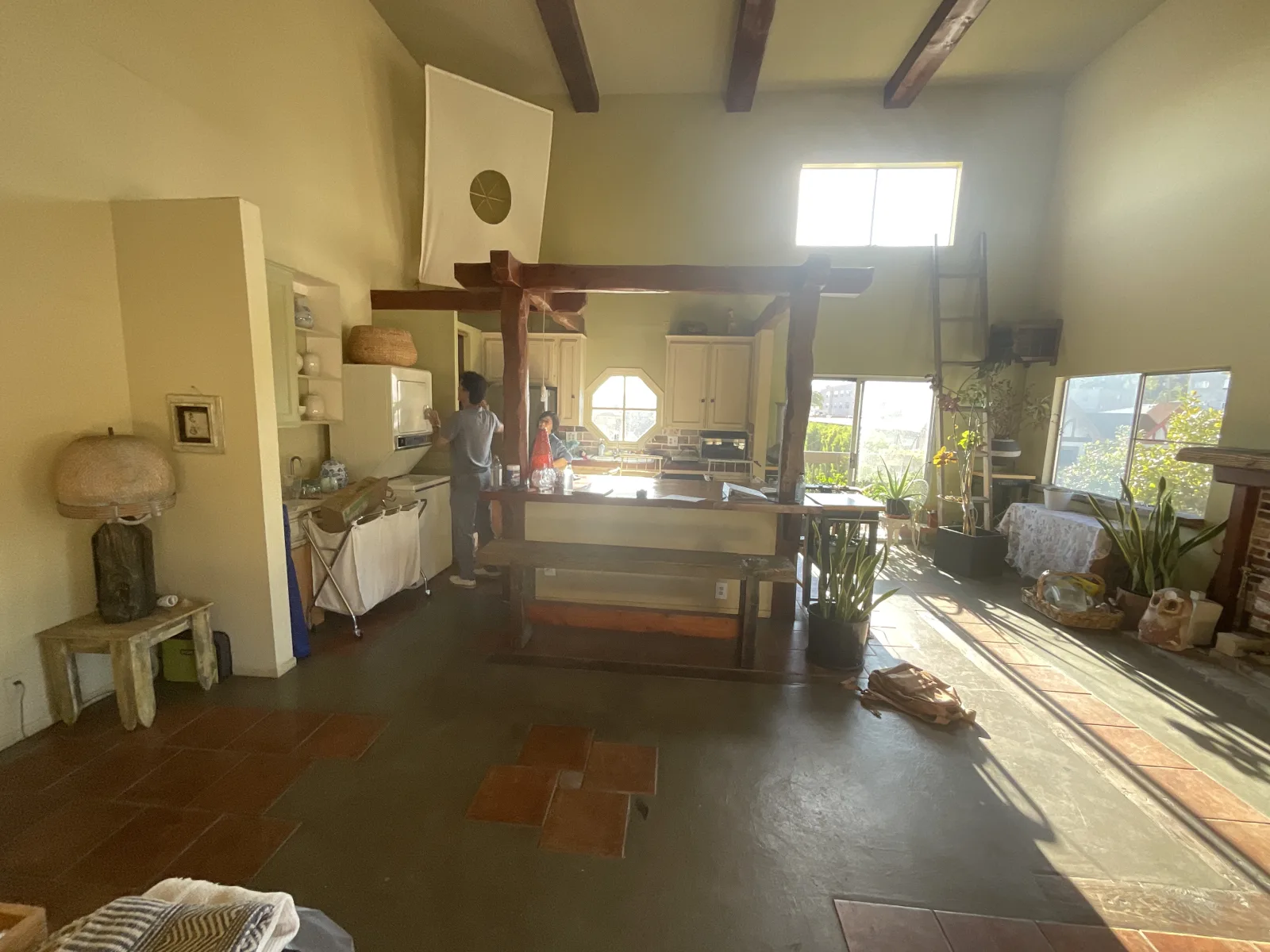 Original great room with exposed wood beams and posts before PMK Development's remodel on Harvard Boulevard in Los Angeles