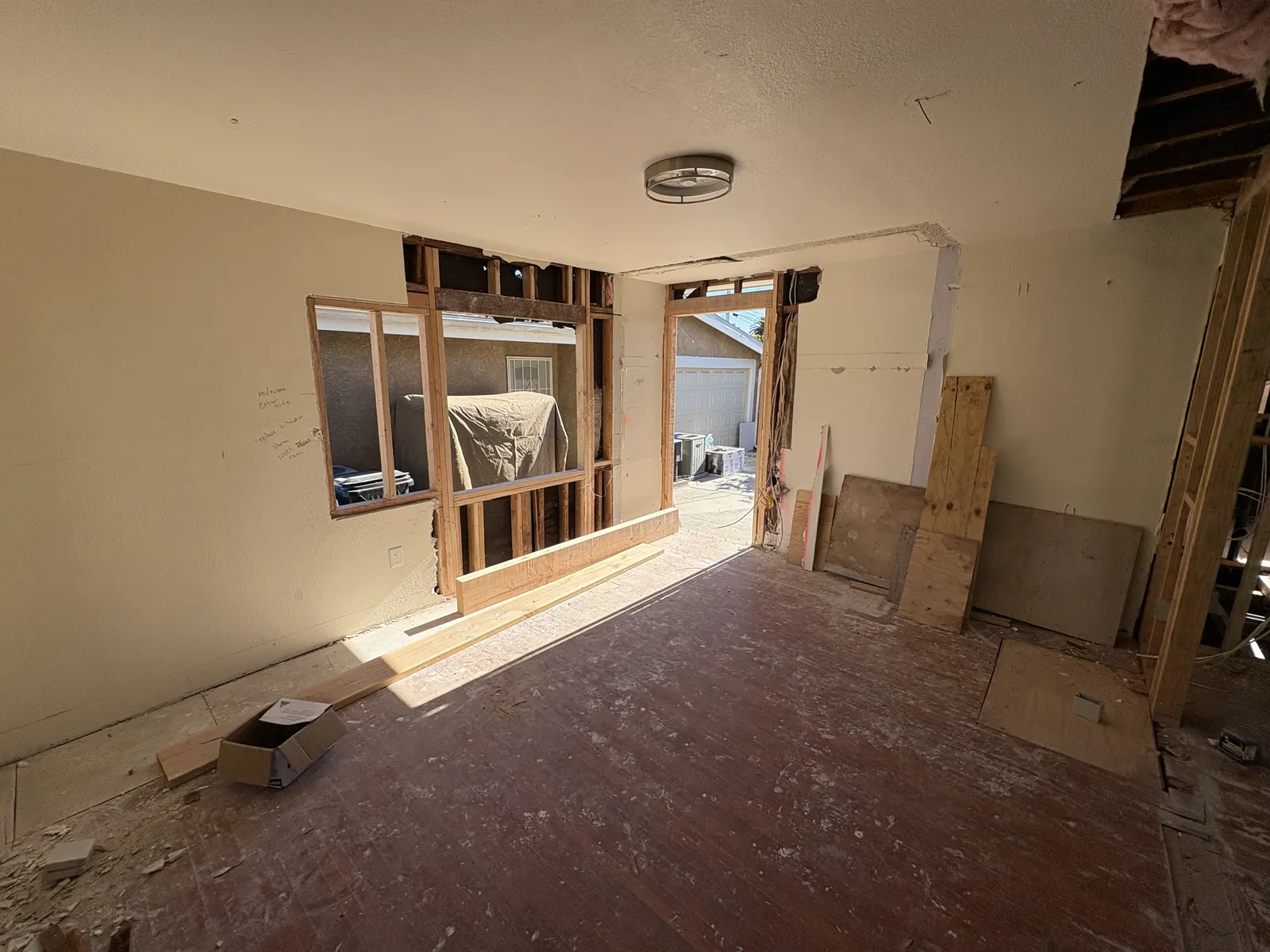 A partition wall opened up between rooms to create the open-concept layout in PMK Development's remodel on Hobart Blvd in Los Angeles.