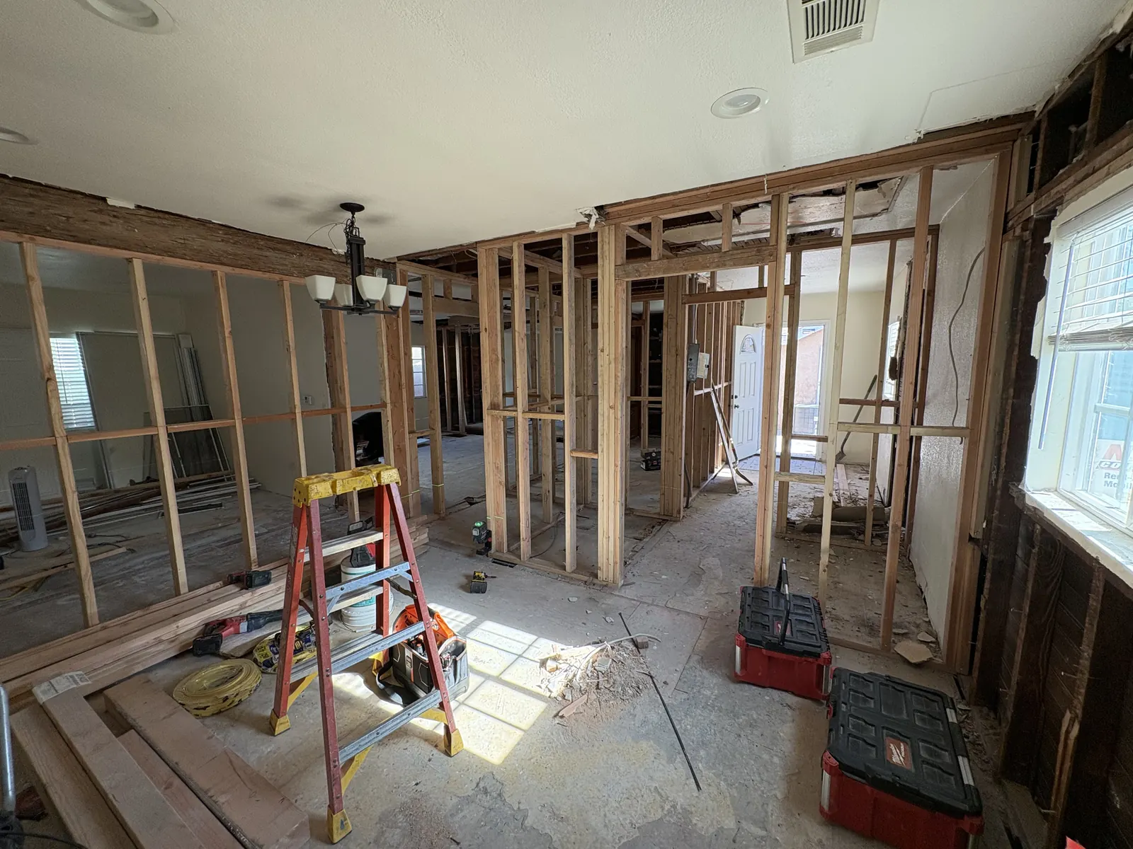 Fresh stud framing lays out the new open-concept floor plan during PMK Development's remodel on Hobart Blvd in Los Angeles.