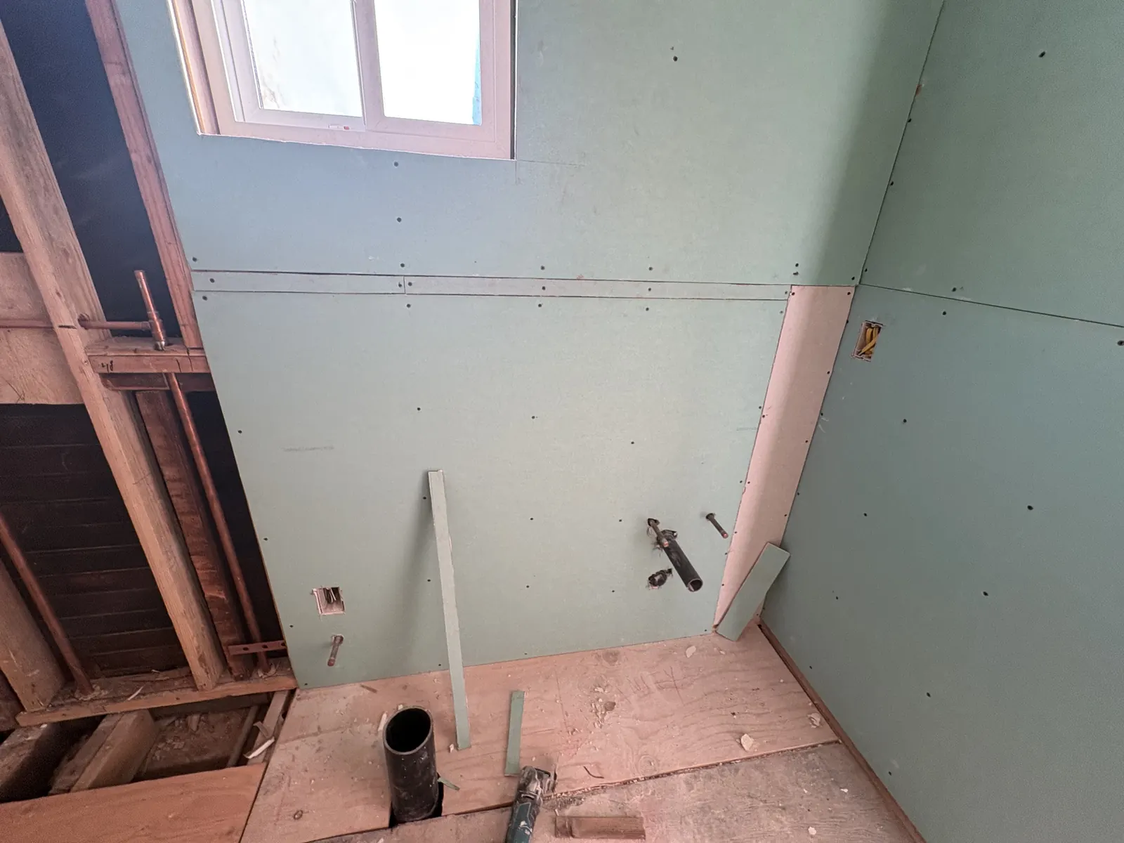 Moisture-resistant drywall hung in a bathroom during PMK Development's open-concept remodel on Hobart Blvd in Los Angeles.