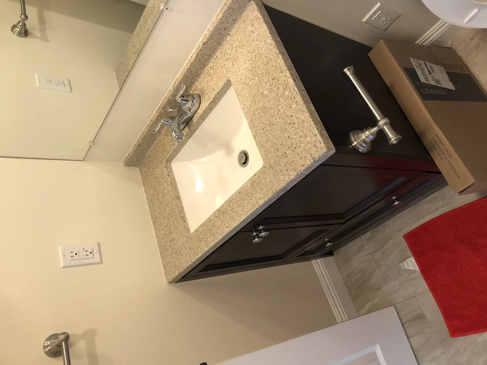 A new vanity, countertop, and faucet set in place during bathroom work in Phase 1 of PMK's remodel on Hobart Blvd in Los Angeles.