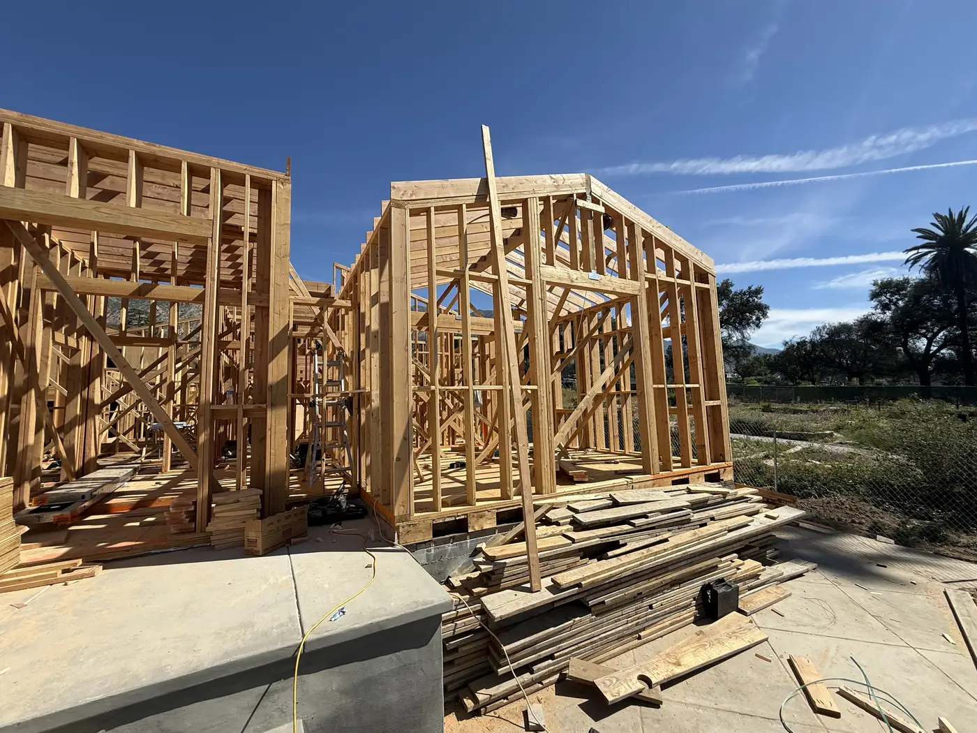 Ceiling joists and first-floor ceiling framing of the main home at PMK Development's Altadena rebuild.