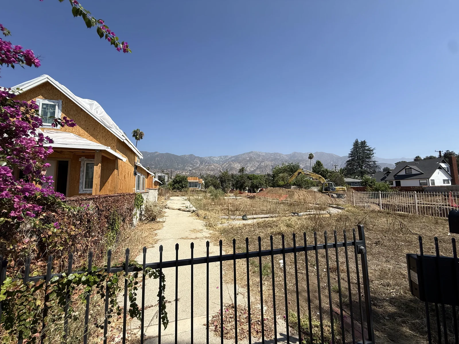 View through the Mendocino front gate across the lot before construction, toward the Altadena foothills