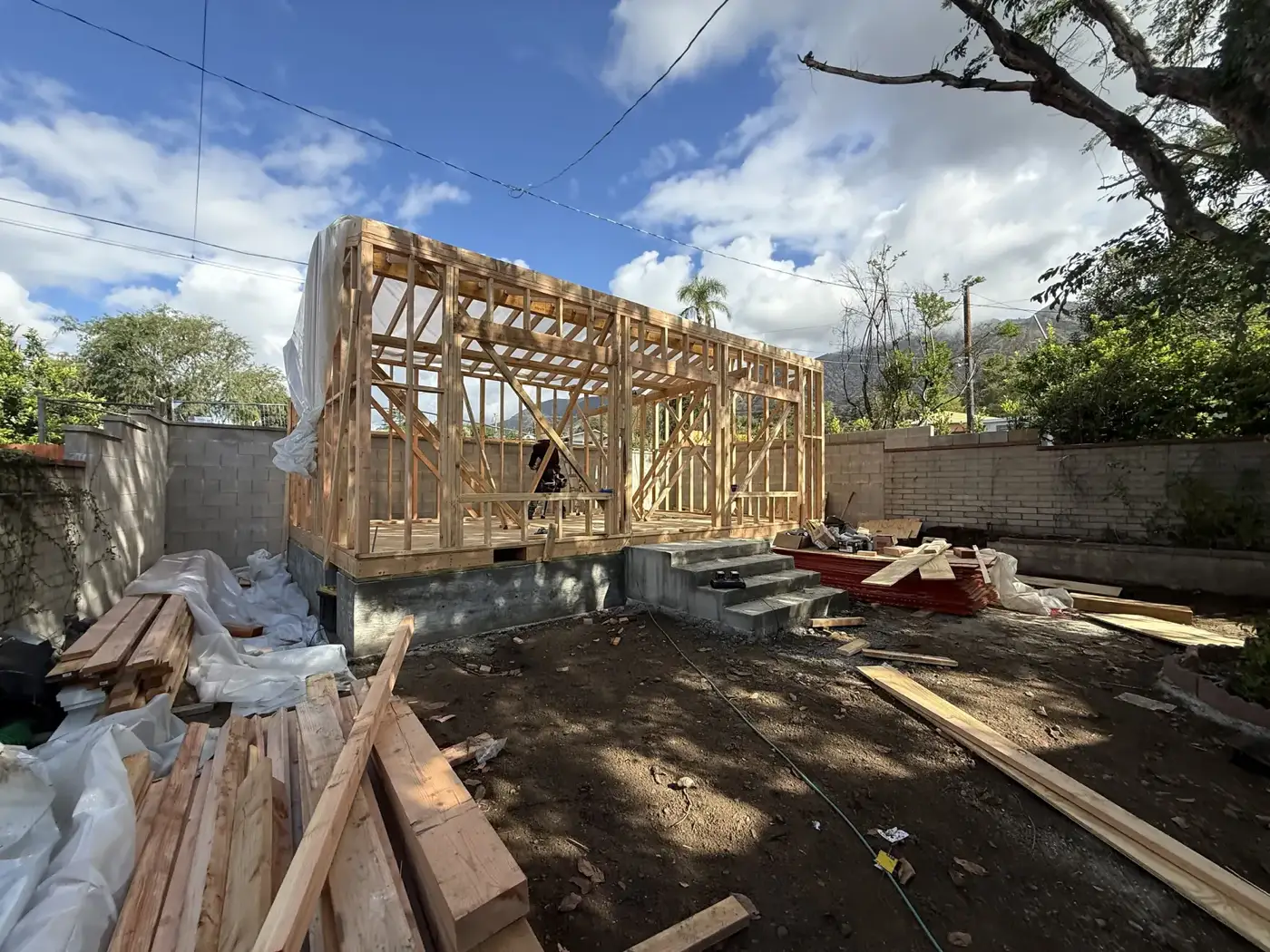 First framed walls rising from the deck at PMK Development's Mt. Curve Avenue project.
