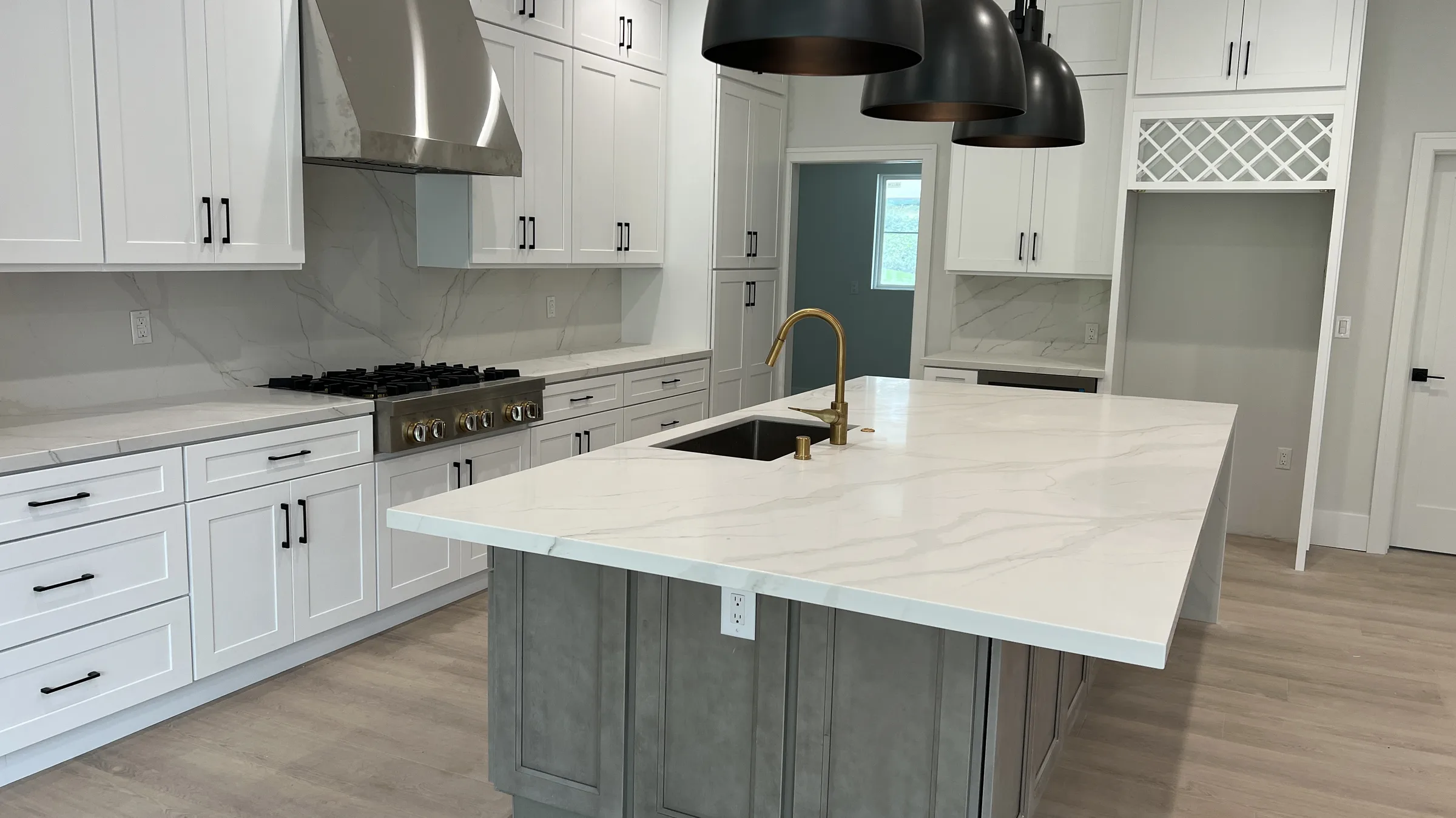 Finished kitchen and open living area from a PMK Development project in La Cañada Flintridge