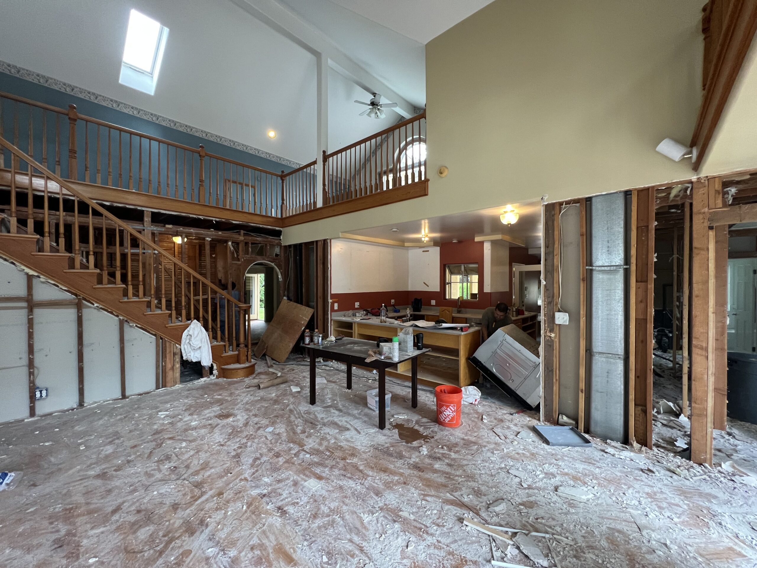 IMG_2019 General contractor assessing older home conditions before coordinated renovation work